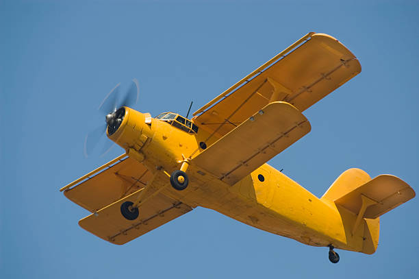 ビンテージロシアバイプレーン - airplane stunt yellow flying ストックフォトと画像