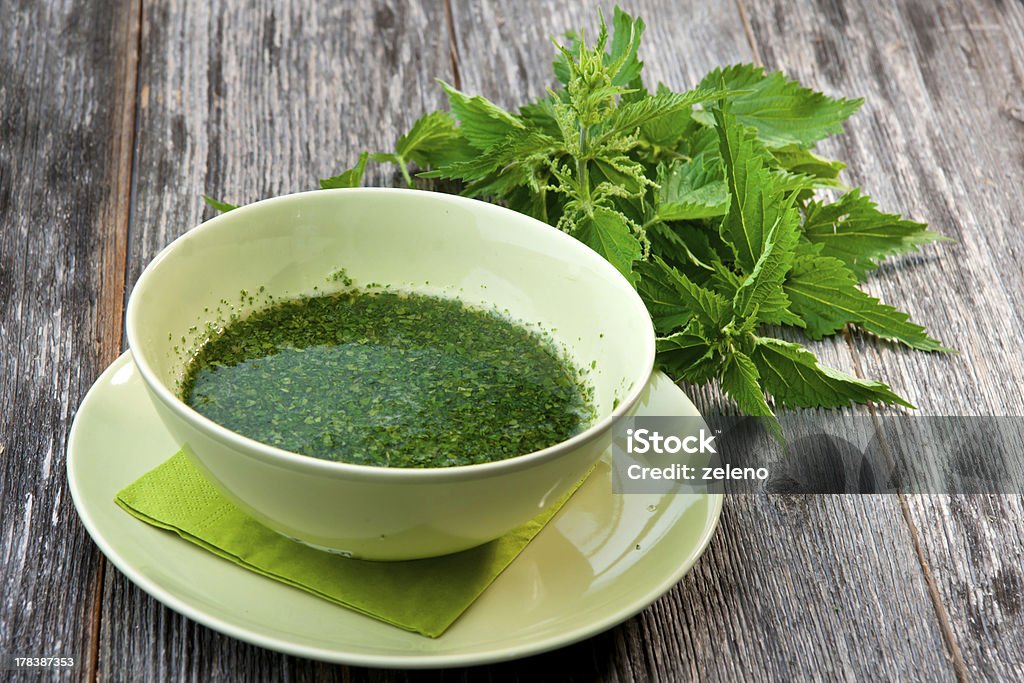 Stringing nettle soup Nettle Stock Photo