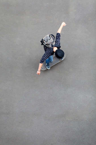 overhead view of teen boy skateboarding