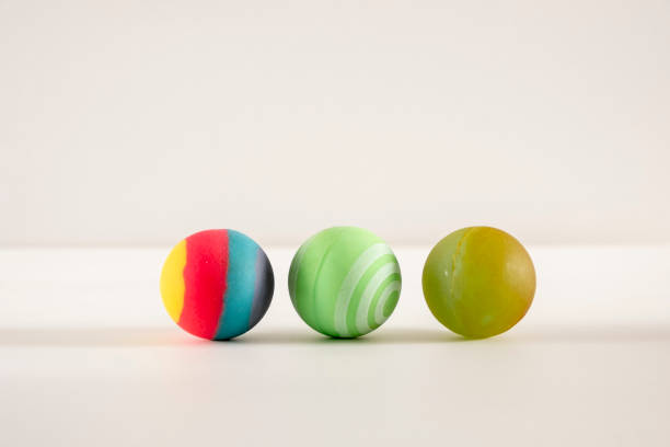 istock Rubber ball of various colors on a keyboard. 1783875128