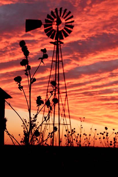 Windmill with perfect red sunset stock photo