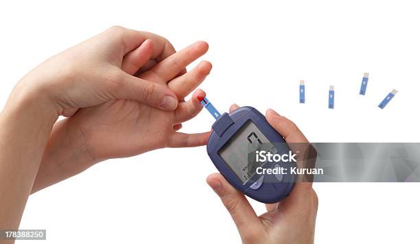 Woman Checks Glucose Level In Blood At The Child Stock Photo - Download Image Now - Child, Glucometer, Diabetes