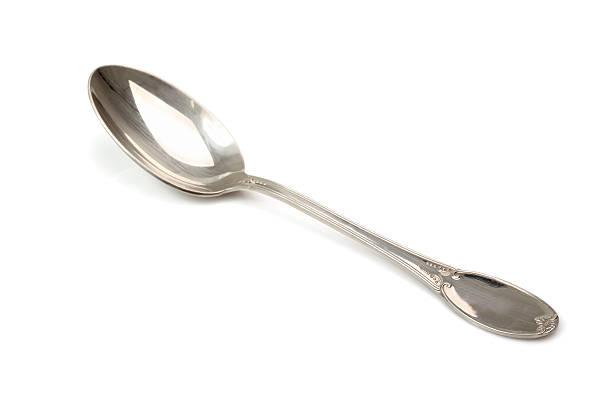 Silver spoon Silver spoon. Isolated with clipping path. baby spoon stock pictures, royalty-free photos & images