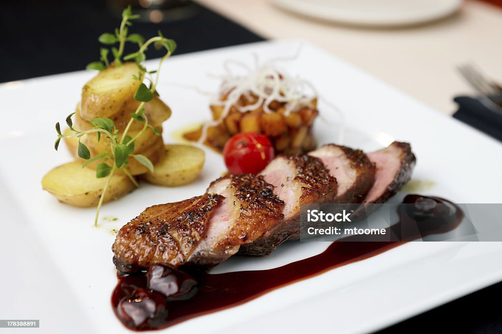 Roasted duck "Roasted duck with pear,marinated in red wine and mascarpone rose" Beauty Stock Photo