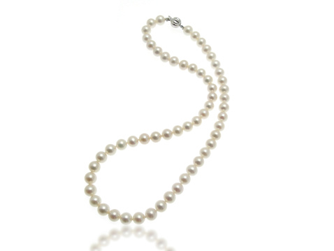 Golden necklace with pearl isolated on white.