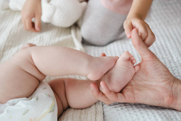 istock Little baby and sibling close-up 1783894533