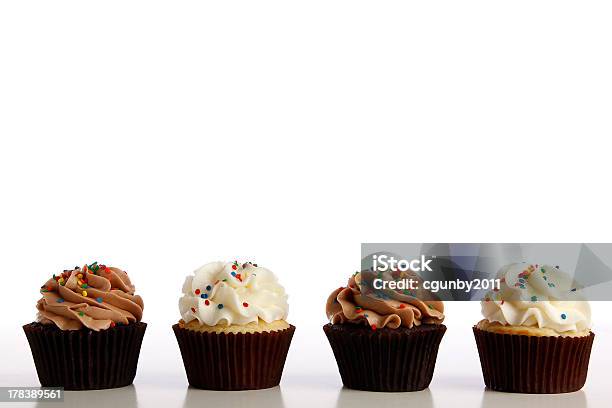 Line Of Cupcakes Stock Photo - Download Image Now - Cupcake, Baking, Buttercream