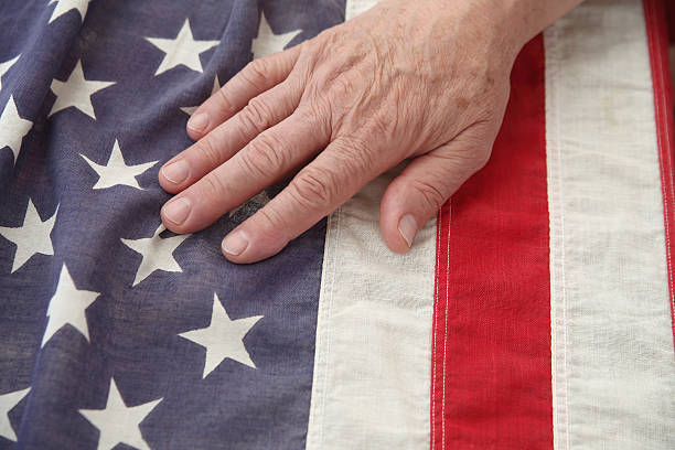 istock man with hand on USA flag 178389572