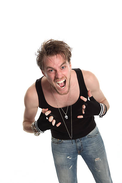 istock Screaming rocker showing the heavy metal sign 178389721