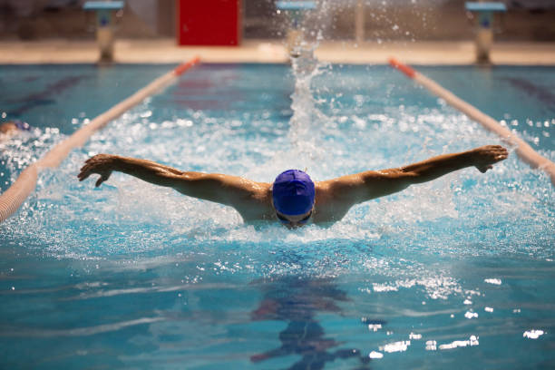 istock A skilled athlete showcases the butterfly stroke in an Olympic-sized pool. 1783902207