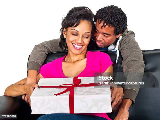 Black Male Giving A Surprise Gift To The Female Stock Photo - Download Image Now - Abundance, Adult, Adults Only