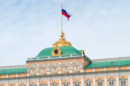 Green Cupola of Big Kremlin palace in Moscow with Russian flag on spire