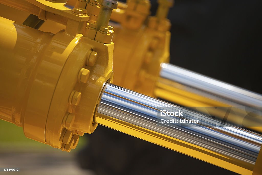 New hydraulic pistons Two yellow pistons Hydraulic Platform Stock Photo