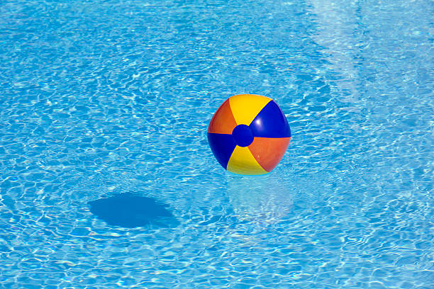 istock inflated plastic ball flying in the pool 178391239