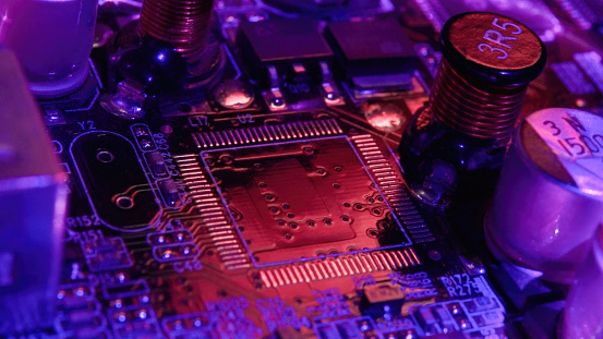 Computer chip under neon lights.