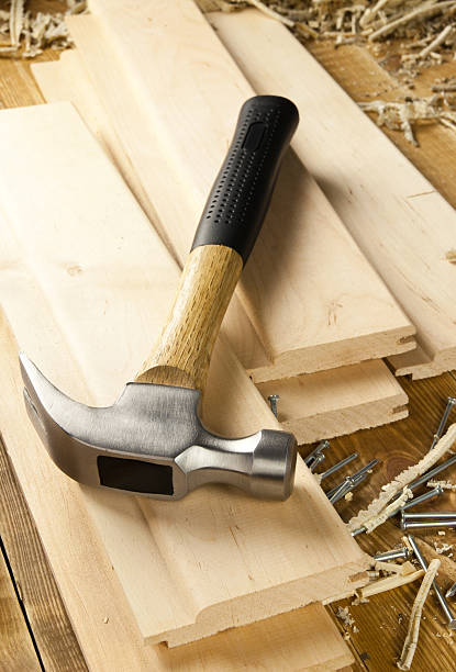 istock Hammer and nails are on a wooden planks 178391540