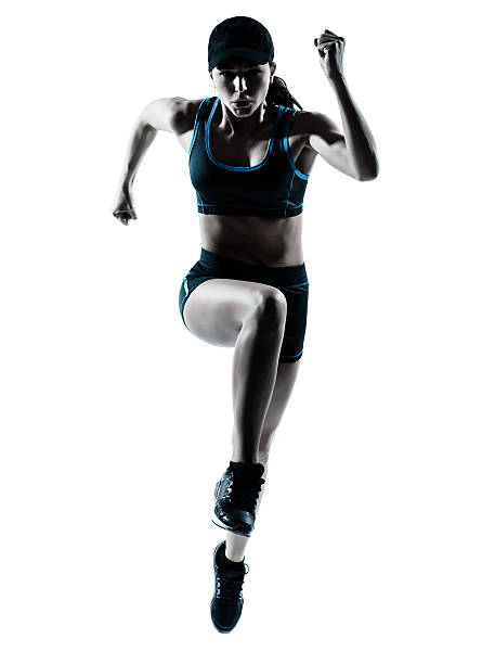 женщина бегун jogger прыжки - female silhouette beautiful professional sport стоковые фото и изображения