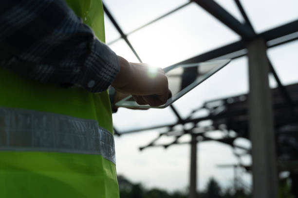 istock inspector or engineer is inspecting construction and quality assurance new house using a tablet. Engineers or architects or contactor work to build the house before handing it over to the homeowne 1783921941