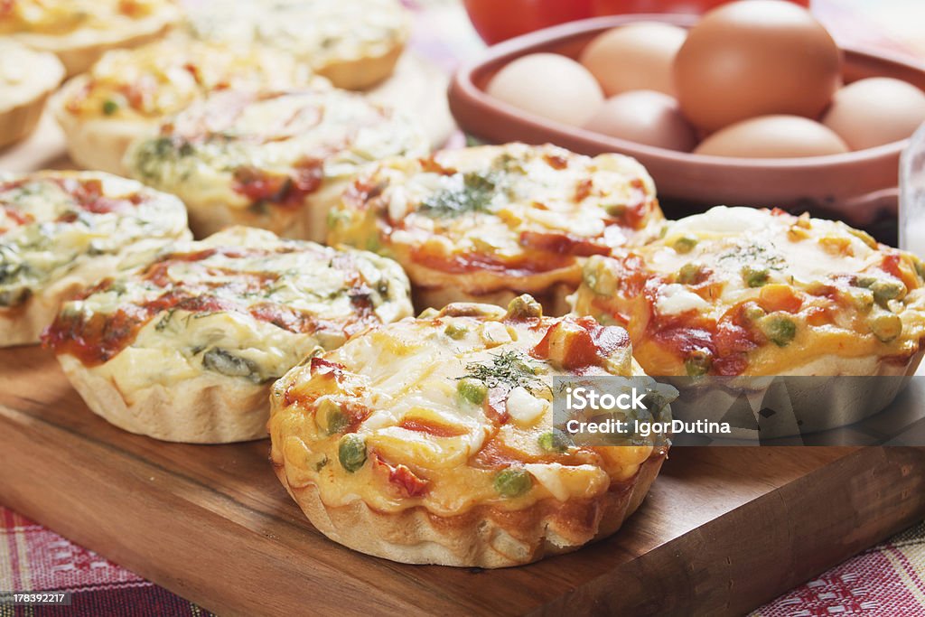 Mini quiche with vegetable "Mini quiche pie with vegetables, healthy vegetarian food" Vegetable Pie Stock Photo