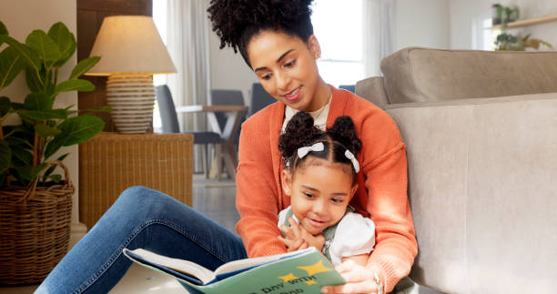 istock Mom, girl and books on floor, reading and education for development, study and teaching in living room. Learning, mother and daughter with story, language and happy in family home with support 1783923981