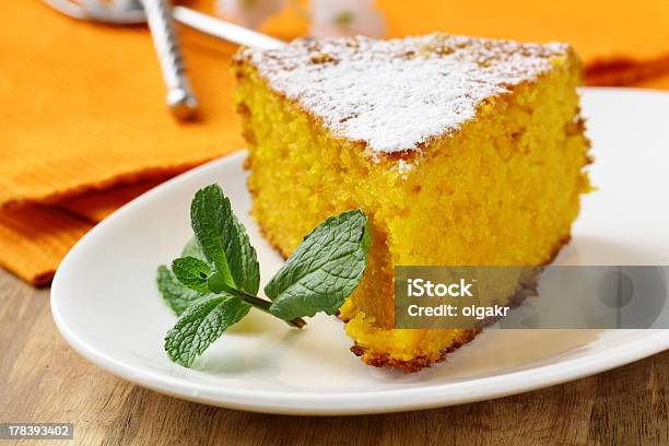 Carrot Cake With Powdered Sugar And Mint Stock Photo - Download Image Now - Carrot Cake, Baked, Bakery