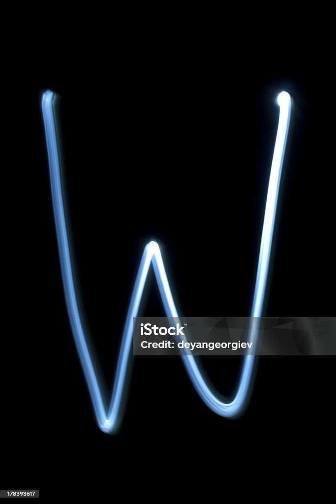 The letter W from neon light. The letter W from natural neon light. Illuminated Stock Photo