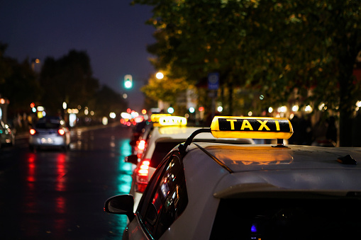 Taxi on the busy city street in Berlin, Germany.