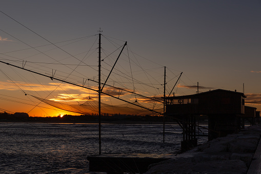 Traditional Fishing net Houses in Chioggia at sunset