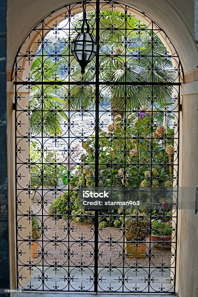 lake house idyllic view inside, looking out of the gate Gate Stock Photo