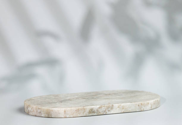istock Abstract empty marble board with shadows leaves on a gray background. Layout concept for promotional product presentation, sale or cosmetics display. 1783948089