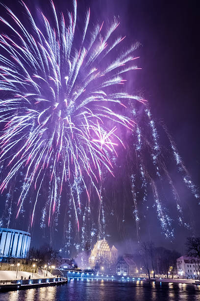 istock Multicolored fireworks over the river in city 178394920