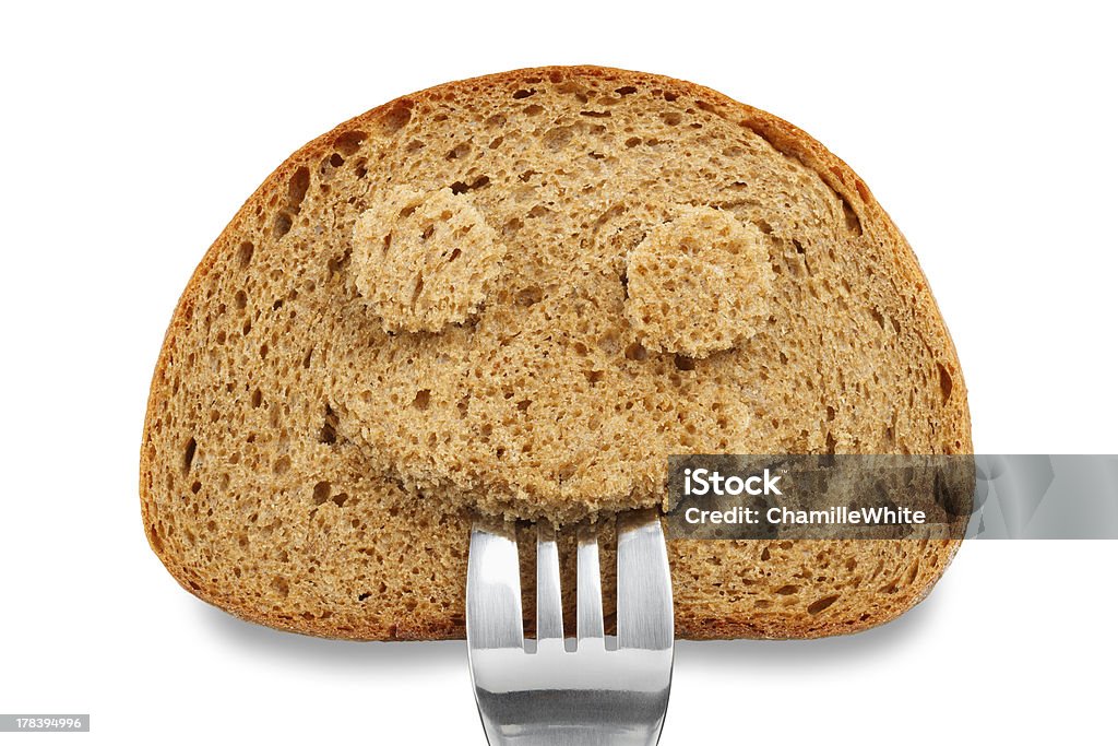 Chleb przekroju jako uśmiech twarz z Widelec w ustach - Zbiór zdjęć royalty-free (Chleb 7 ziaren)