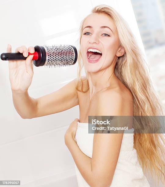 Young Woman In The Morning At Bathroom Stock Photo - Download Image Now - Singing, Comb - Hair Care, Combing