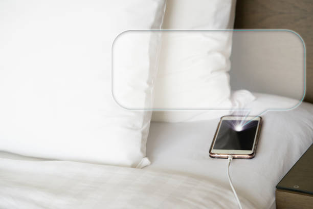 istock smart phone show message on bed and pillow in the morning 1783953258