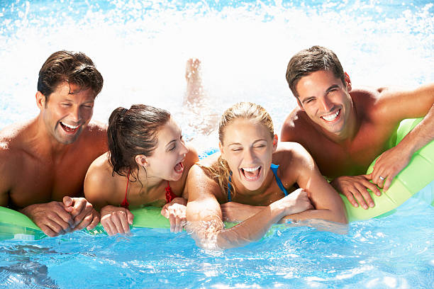 istock Group Of Friends Having Fun In Swimming Pool 178395349