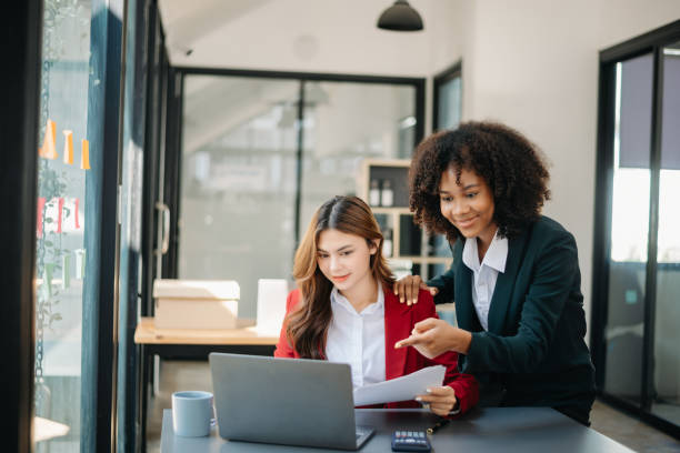 istock Two business workers talking on the smartphone and using laptop at the office. 1783955337