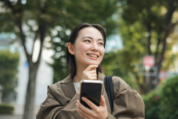 istock Asian woman using a smart phone 1783956699