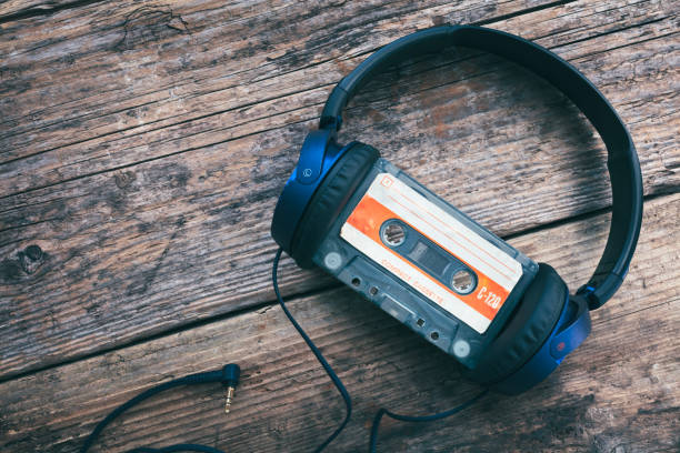 istock Audio compact cassette tape and headphones background 1783966893