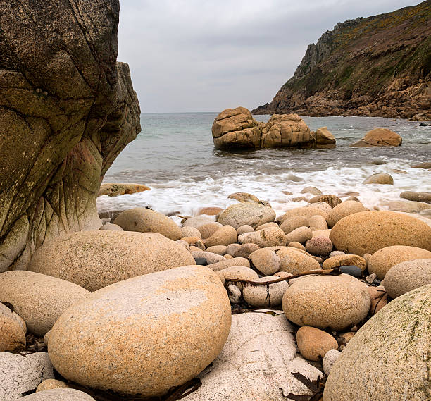 istock Water worn ancient rocks detail on secluded beach 178398356