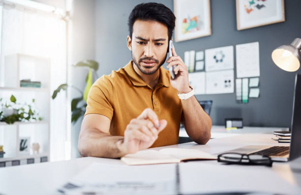 istock Phone call, confused and Asian man with problem in office for issue, mistake and error in office. Communication, business and male worker on smartphone talking, frustrated and consulting for help 1783986787