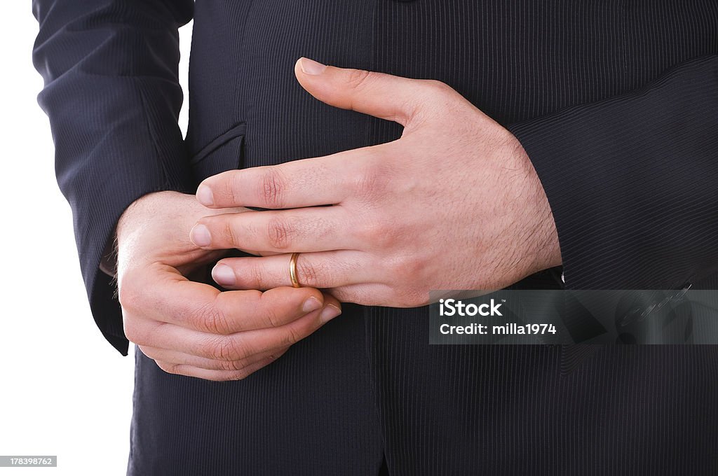 Business man taking off his wedding ring. Infidelity Stock Photo