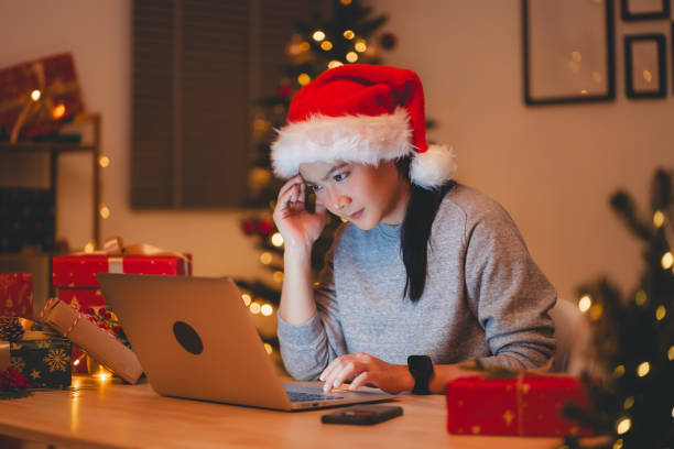 istock Asian woman have a problem with work, sitting at home office on Christmas day. 1783991369