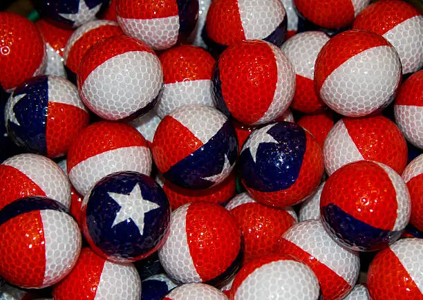 Pile of Texas and Puerto Rico flag theme golfballs