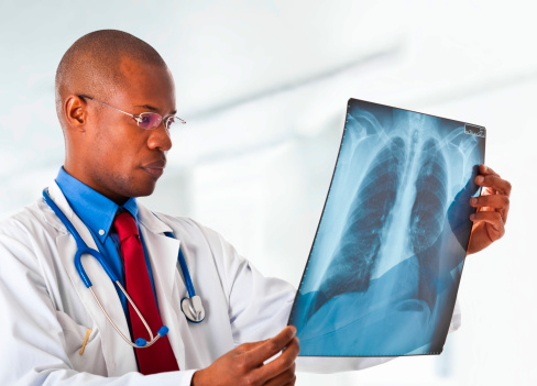 Portrait of a doctor looking at a radiography