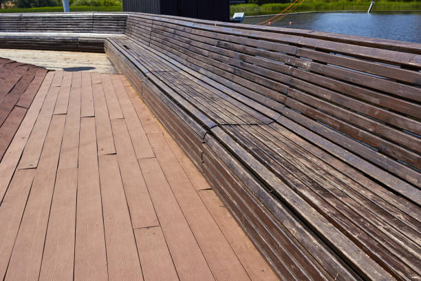 istock a large wooden bench next to the lake. 1783998771