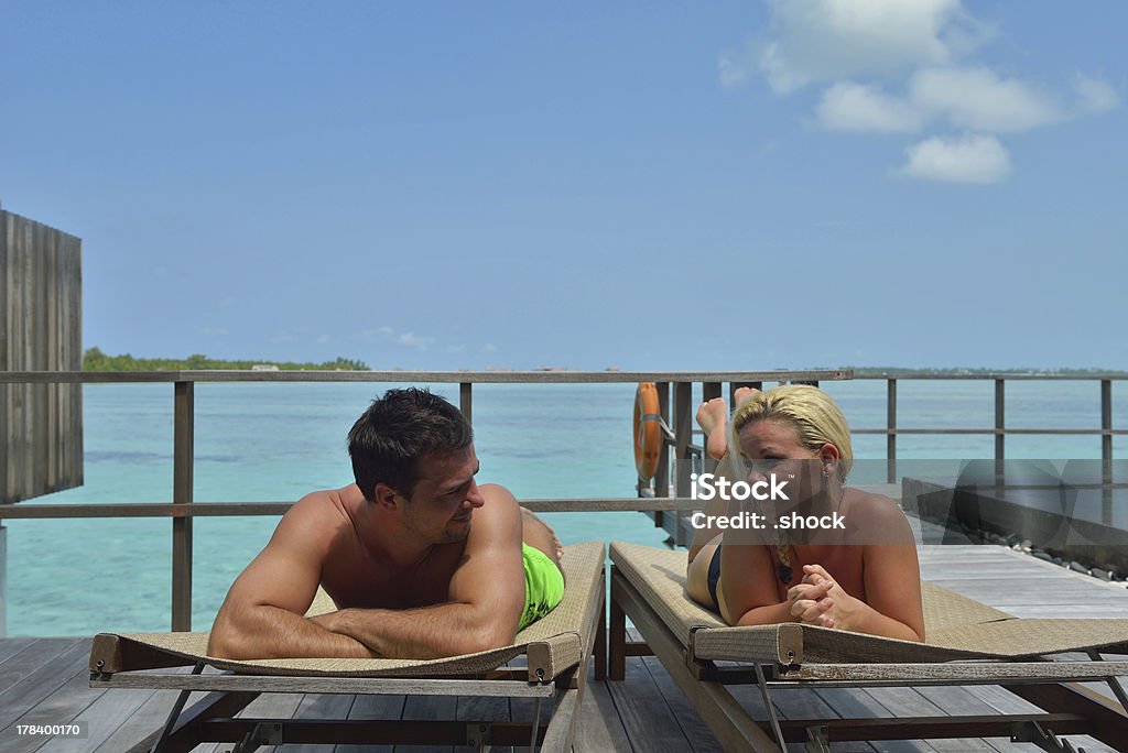 happy young  couple at summer vacation have fun and relax happy young  couple at summer vacation have fun and relax at beautiful sunny  day Adult Stock Photo