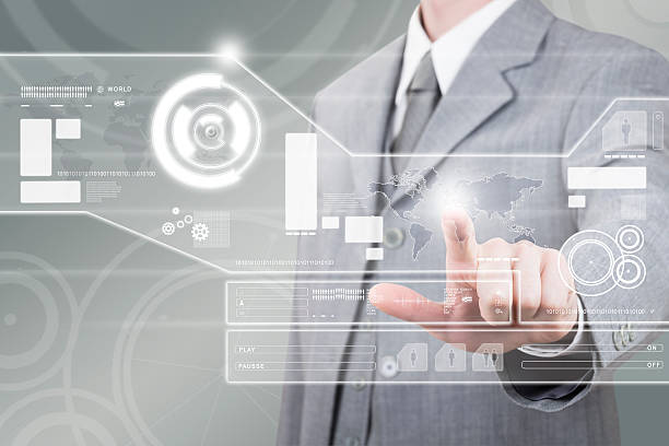 istock Businessman in gray suit interacting with futuristic panel 178400409