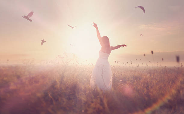istock beautiful girl in a field at sunrise 178400535