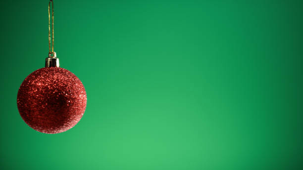 istock Red Christmas ball with green Background 1784005469