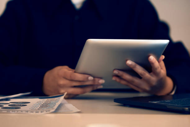 istock Hands, business woman and typing on tablet in office, working on email or project online. Technology, social media and female professional writing reports, planning or internet research at night. 1784017042